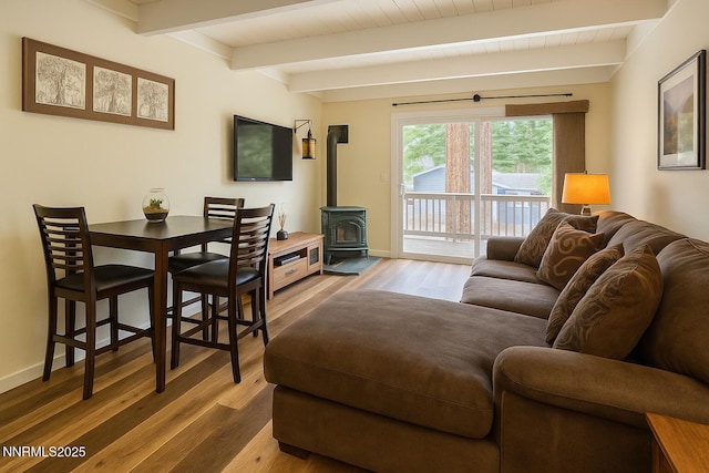801 Northwood Blvd Unit 10, Incline Village, NV 89451 - living area with a wood stove, wood finished floors, beamed ceiling, and baseboards