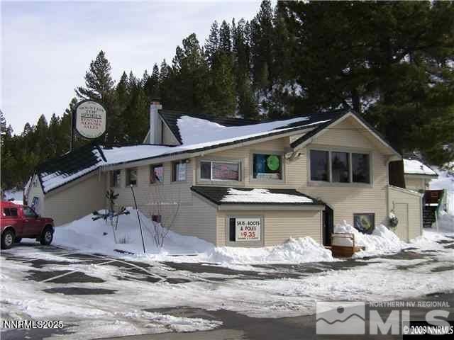 11000 Mount Rose Hwy, Reno, NV 89511 - view of front of house with a chimney and a garage