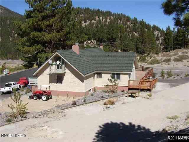 11000 Mount Rose Hwy, Reno, NV 89511 - back of property with a chimney and a view of trees