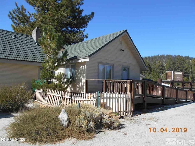 11000 Mount Rose Hwy, Reno, NV 89511 - rear view of property with a wooden deck and a chimney