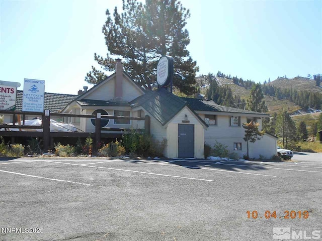 11000 Mount Rose Hwy, Reno, NV 89511 - view of front facade featuring uncovered parking and a mountain view
