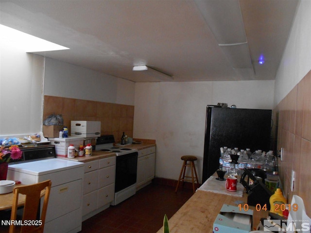 11000 Mount Rose Hwy, Reno, NV 89511 - kitchen with electric stove, refrigerator, light countertops, and freestanding refrigerator