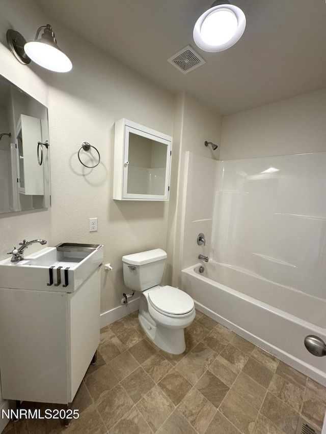 675 E Taylor St, Reno, NV 89502 - bathroom featuring toilet, washtub / shower combination, baseboards, and vanity