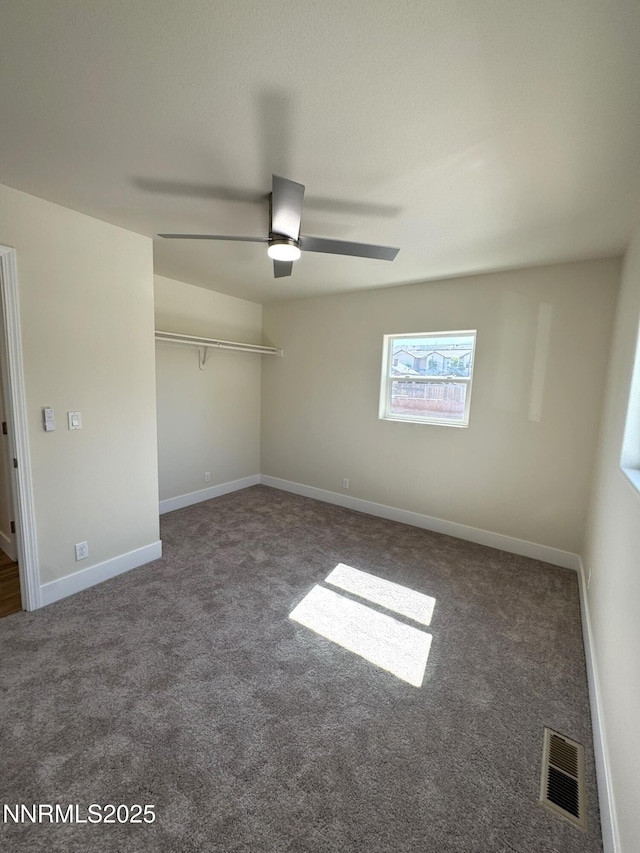 675 E Taylor St, Reno, NV 89502 - unfurnished bedroom featuring carpet flooring, a closet, baseboards, and a ceiling fan
