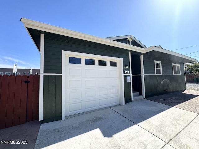 675 E Taylor St, Reno, NV 89502 - view of front facade with driveway and a garage