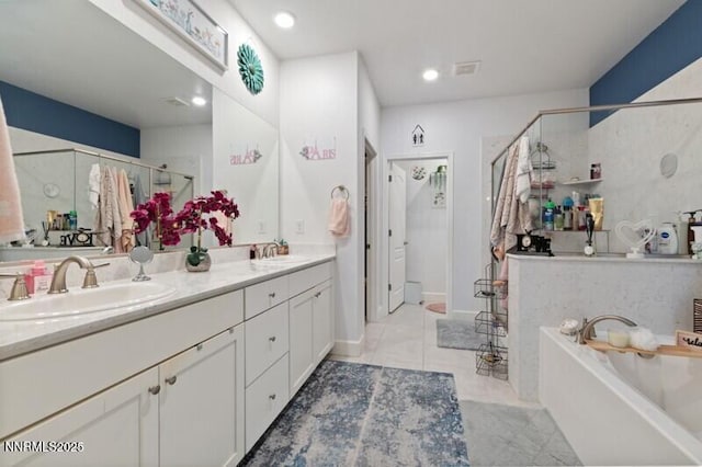 6127 Red Stable Rd, Sparks, NV 89436 - full bathroom featuring a shower stall, a garden tub, double vanity, recessed lighting, and tile patterned floors