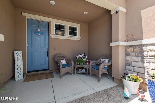 6127 Red Stable Rd, Sparks, NV 89436 - property entrance with stucco siding and covered porch