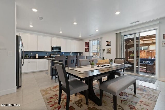 6127 Red Stable Rd, Sparks, NV 89436 - dining area featuring light tile patterned floors, recessed lighting, and baseboards