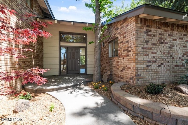 2080 Del Rio Ln, Reno, NV 89509 - doorway to property with brick siding and a porch