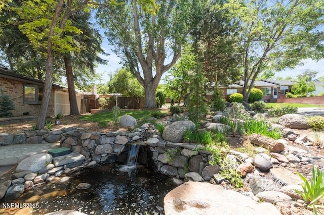 2080 Del Rio Ln, Reno, NV 89509 - view of yard featuring a garden pond