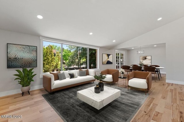2080 Del Rio Ln, Reno, NV 89509 - living room with light wood-style flooring, recessed lighting, baseboards, a chandelier, and lofted ceiling