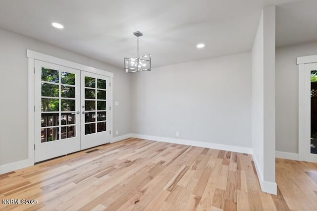 2080 Del Rio Ln, Reno, NV 89509 - unfurnished dining area with french doors, wood finished floors, baseboards, a chandelier, and recessed lighting