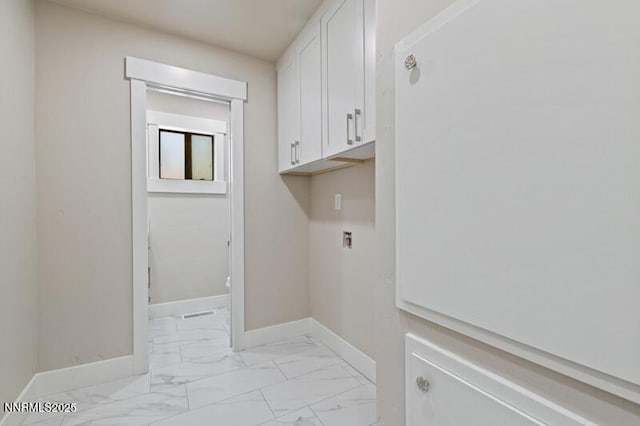 2080 Del Rio Ln, Reno, NV 89509 - washroom featuring light marble finish flooring, cabinet space, and baseboards