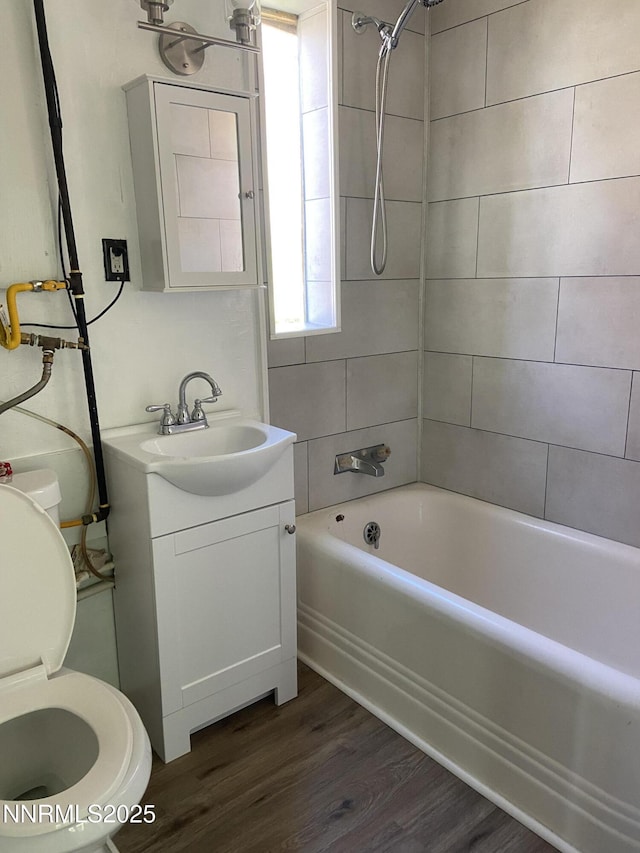 285 Main St, Silver City, NV 89428 - bathroom featuring shower / bath combination, vanity, toilet, and wood finished floors