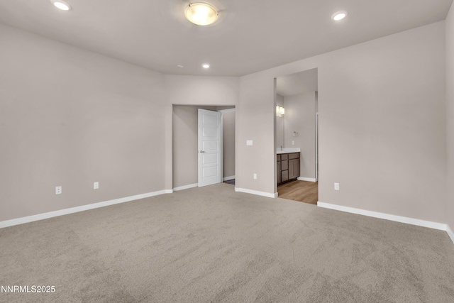 1466 Copper Point Cir, Reno, NV 89519 - unfurnished bedroom with carpet floors, recessed lighting, baseboards, and ensuite bathroom