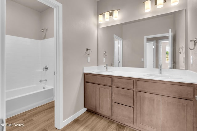1466 Copper Point Cir, Reno, NV 89519 - full bath featuring wood finished floors, shower / washtub combination, double vanity, and baseboards