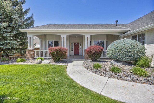 2866 La Cresta Cir, Minden, NV 89423 - view of front of property featuring covered porch, a front lawn, and roof with shingles