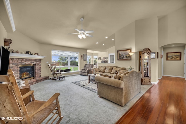 2866 La Cresta Cir, Minden, NV 89423 - living room with a ceiling fan, arched walkways, a fireplace, hardwood / wood-style flooring, and baseboards