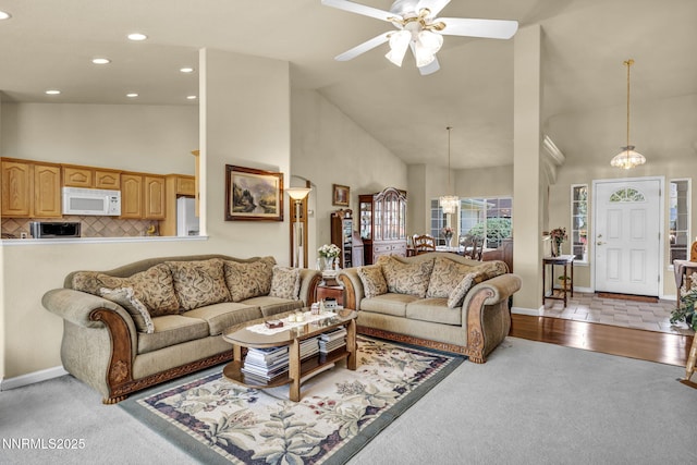 2866 La Cresta Cir, Minden, NV 89423 - living area featuring high vaulted ceiling, ceiling fan, recessed lighting, a chandelier, and carpet flooring