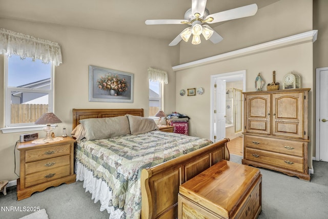 2866 La Cresta Cir, Minden, NV 89423 - bedroom with light carpet, a ceiling fan, and ensuite bathroom