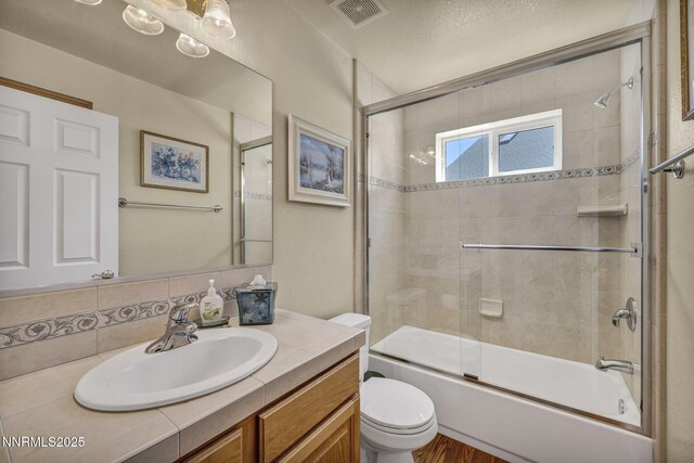 2866 La Cresta Cir, Minden, NV 89423 - bathroom featuring vanity, combined bath / shower with glass door, and toilet