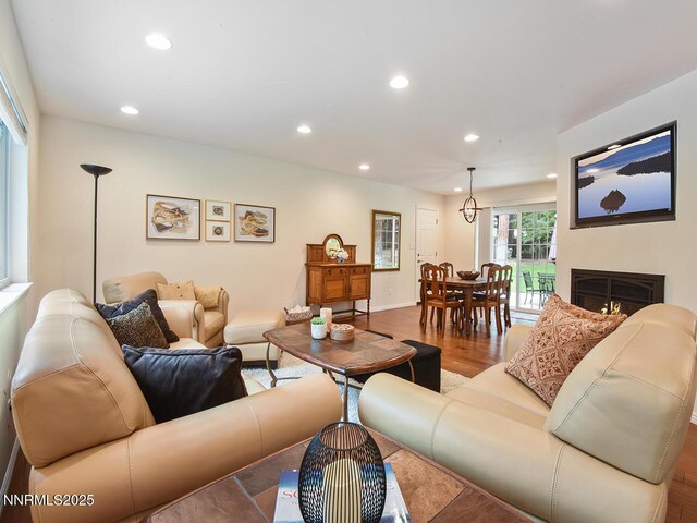 119 Pine Cone Rd, Incline Village, NV 89451 - living area featuring recessed lighting, wood finished floors, and a warm lit fireplace