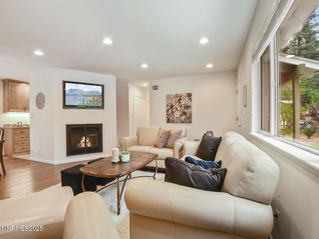 119 Pine Cone Rd, Incline Village, NV 89451 - living room featuring recessed lighting, light wood finished floors, a glass covered fireplace, and baseboards