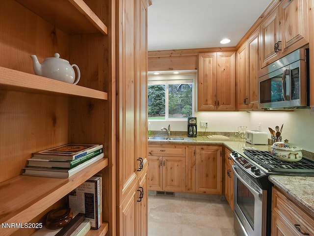 119 Pine Cone Rd, Incline Village, NV 89451 - kitchen featuring appliances with stainless steel finishes, a sink, and light stone countertops
