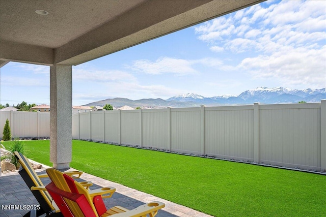 11235 Freedom Range Ln, Reno, NV 89521 - view of yard featuring a mountain view and a patio