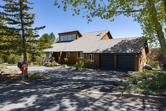 16360 Jefte Ct, Reno, NV 89511 - rustic home featuring driveway and an attached garage