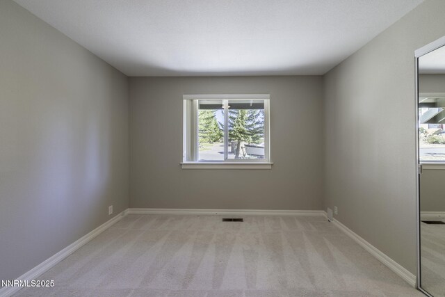 16360 Jefte Ct, Reno, NV 89511 - spare room with light colored carpet and baseboards