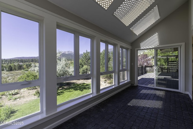 16360 Jefte Ct, Reno, NV 89511 - unfurnished sunroom featuring a mountain view, lofted ceiling, and carpet flooring
