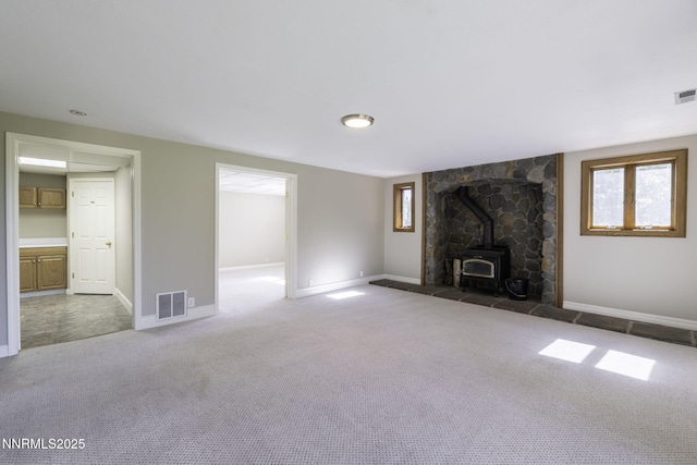 16360 Jefte Ct, Reno, NV 89511 - unfurnished living room with a wood stove and carpet
