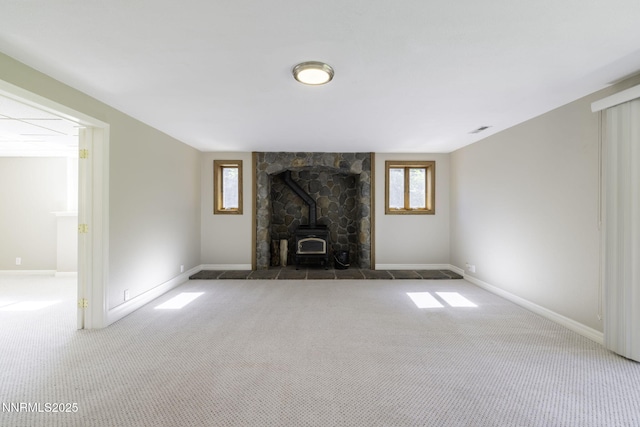 16360 Jefte Ct, Reno, NV 89511 - unfurnished living room with a wood stove and carpet flooring