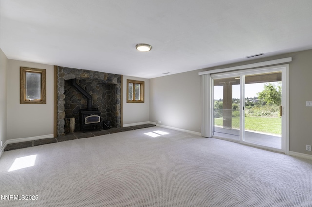 16360 Jefte Ct, Reno, NV 89511 - unfurnished living room featuring a wood stove and carpet floors