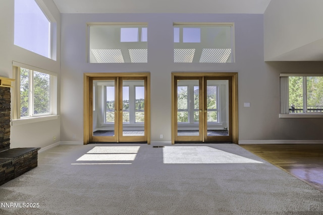 16360 Jefte Ct, Reno, NV 89511 - carpeted foyer entrance featuring french doors, a towering ceiling, and plenty of natural light