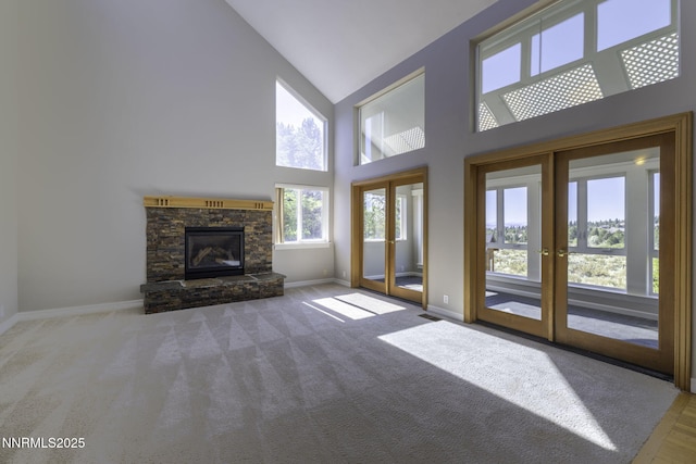 16360 Jefte Ct, Reno, NV 89511 - unfurnished living room with french doors, high vaulted ceiling, a fireplace, and carpet floors