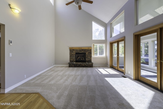 16360 Jefte Ct, Reno, NV 89511 - unfurnished living room featuring healthy amount of natural light, high vaulted ceiling, a ceiling fan, carpet, and a fireplace