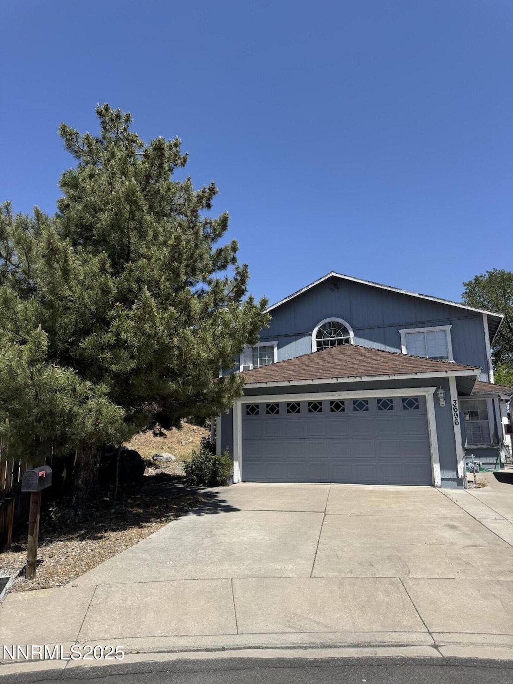 3696 Shale Ct, Reno, NV 89503 - view of front of home with a garage, concrete driveway, and a shingled roof