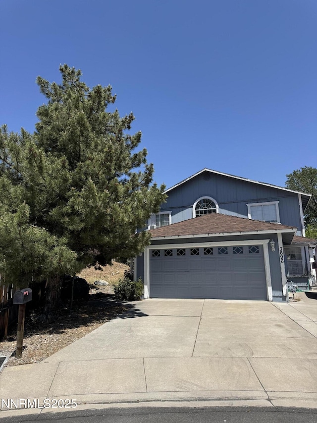 3696 Shale Ct, Reno, NV 89503 - view of front of home with a garage, concrete driveway, and a shingled roof