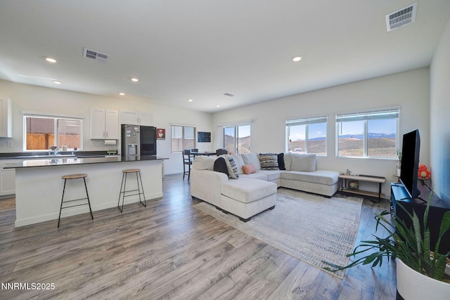 2040 Painted Sky Way, Sun Valley, NV 89433 - living area with wood finished floors, recessed lighting, and baseboards