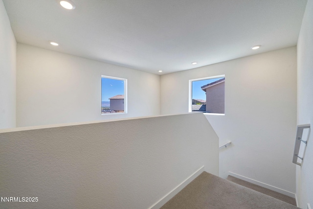 2040 Painted Sky Way, Sun Valley, NV 89433 - hall with an upstairs landing, carpet, baseboards, and recessed lighting