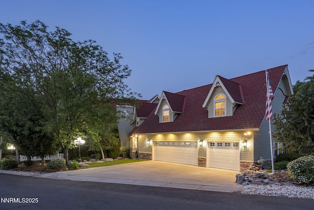 30 Francovich Ct, Reno, NV 89519 - view of front facade with an attached garage, driveway, and stone siding