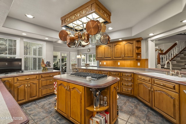 30 Francovich Ct, Reno, NV 89519 - kitchen with open shelves, stainless steel gas stovetop, brown cabinets, a sink, and recessed lighting