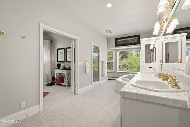 30 Francovich Ct, Reno, NV 89519 - full bath with double vanity, a baseboard heating unit, baseboards, backsplash, and recessed lighting