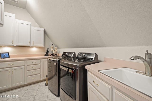 30 Francovich Ct, Reno, NV 89519 - laundry area with washing machine and clothes dryer, cabinet space, and light tile patterned flooring