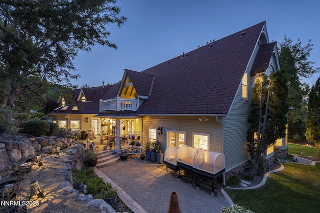30 Francovich Ct, Reno, NV 89519 - rear view of house with a balcony, a patio area, a yard, and a shingled roof
