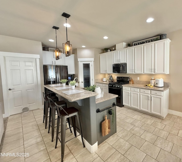 3221 Hackamore Way, Winnemucca, NV 89445 - kitchen featuring black appliances, light tile patterned flooring, a breakfast bar area, white cabinets, and recessed lighting
