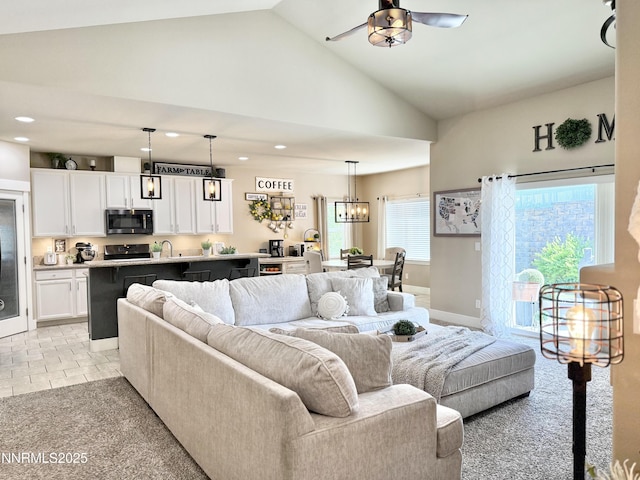 3221 Hackamore Way, Winnemucca, NV 89445 - living room with ceiling fan, recessed lighting, high vaulted ceiling, baseboards, and a chandelier