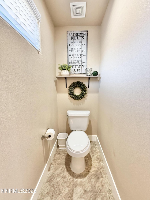 3221 Hackamore Way, Winnemucca, NV 89445 - bathroom featuring baseboards, toilet, and tile patterned flooring